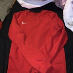 Red Nike sweatshirt  is being swapped online for free