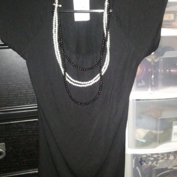 blouse with pearl necklaces is being swapped online for free