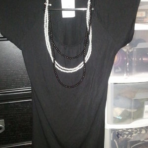 blouse with pearl necklaces is being swapped online for free