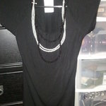 blouse with pearl necklaces is being swapped online for free