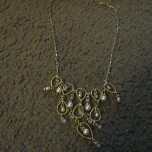 cream and gold necklace is being swapped online for free