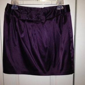 NWOT Purple Satin Bow Skirt is being swapped online for free
