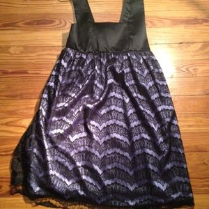 Fancy children's lace and purple and black dress is being swapped online for free