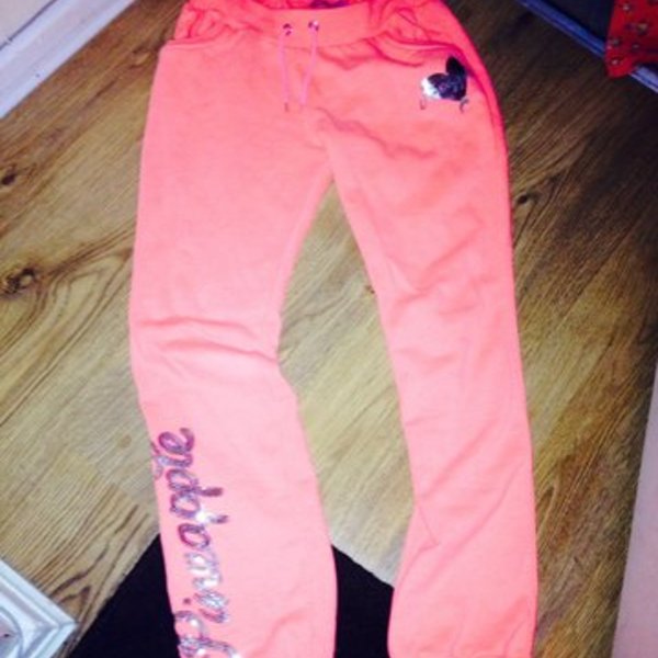 Pineapple tracksuit bottoms neon orange teenager or 10/12 uk is being swapped online for free