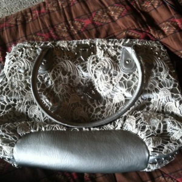 Buckle Brand lace and silver purse is being swapped online for free