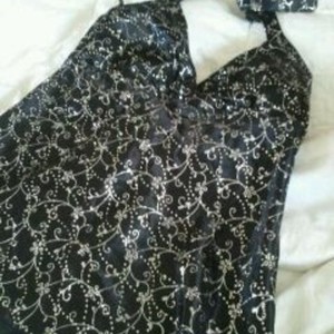XL Sparkly Silver Swirl black cami is being swapped online for free