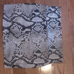 ANIMAL PRINT SKIRT SIZE L is being swapped online for free