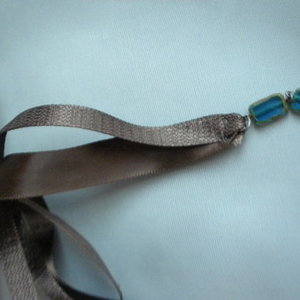 brown ribbon necklace is being swapped online for free