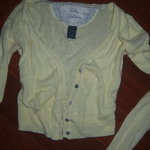 Small yellow short sweater is being swapped online for free