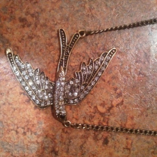 Gold bird necklace is being swapped online for free