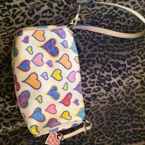 Authentic dooney and Bourke wristlet/purse is being swapped online for free