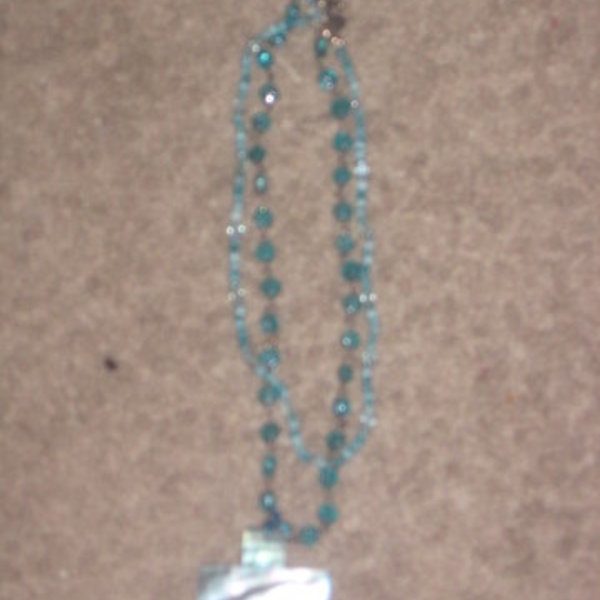 Express Aqua/Turquoise Beaded Necklace With Cross is being swapped online for free