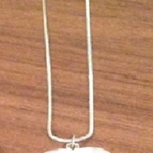 White Heart Pendant/ Necklace - One Size. is being swapped online for free