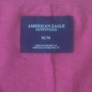 nice hot pink v-neck shirt size: med. (American Eagle) is being swapped online for free