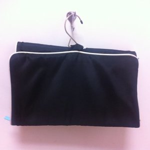 black and teal hanging organizer with teal pouch is being swapped online for free
