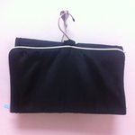 black and teal hanging organizer with teal pouch is being swapped online for free
