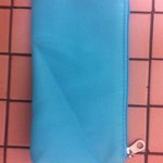 black and teal hanging organizer with teal pouch is being swapped online for free