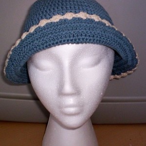 Blue & Cream Knit Bonnet Hat  is being swapped online for free