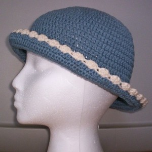 Blue & Cream Knit Bonnet Hat  is being swapped online for free