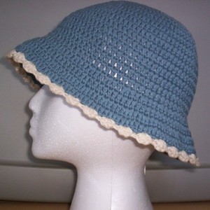Blue & Cream Knit Bonnet Hat  is being swapped online for free