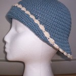 Blue & Cream Knit Bonnet Hat  is being swapped online for free