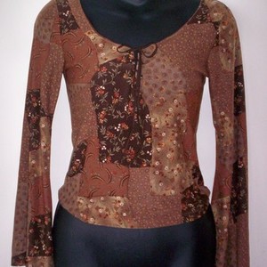 Brown Flowery Top Medium  is being swapped online for free