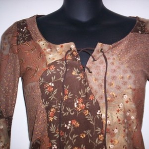 Brown Flowery Top Medium  is being swapped online for free