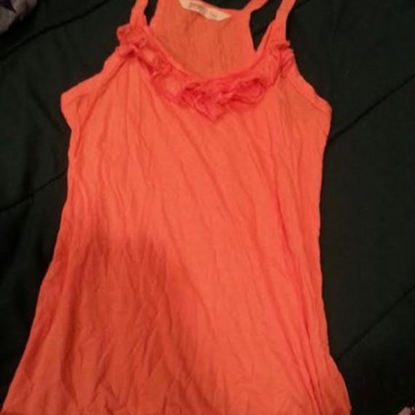 Juniors Orange ruffle tank is being swapped online for free