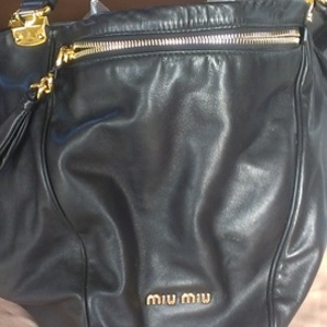Authentic Miu Miu by Prada *RESERVED* is being swapped online for free