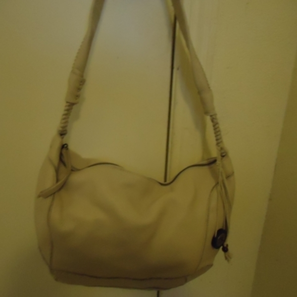Excellent condition Saks white hobo handbag is being swapped online for free