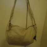 Excellent condition Saks white hobo handbag is being swapped online for free