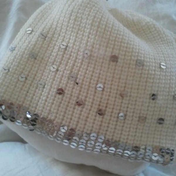 Sequin Ivory Winter Hat. is being swapped online for free