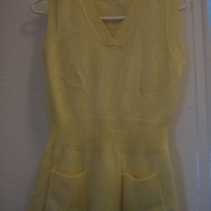 vintage yellow sweater vest is being swapped online for free