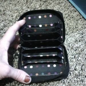 LIKE NEW BLACK WITH POLKA DOTS LEATHER WALLET is being swapped online for free