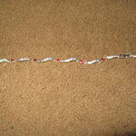 silver and red stone bracelet is being swapped online for free