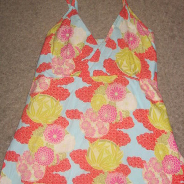 Bright Multi-Colored Top Size Small is being swapped online for free