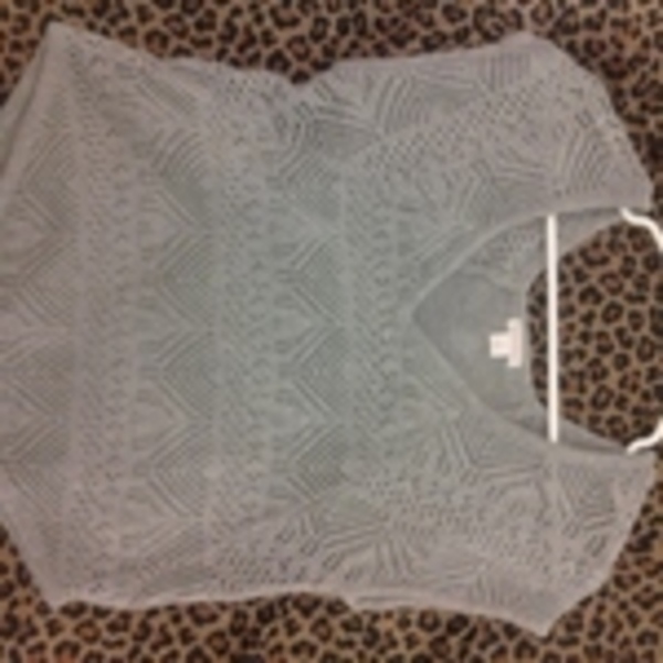 grey nittted top is being swapped online for free