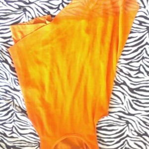 orange tank top is being swapped online for free