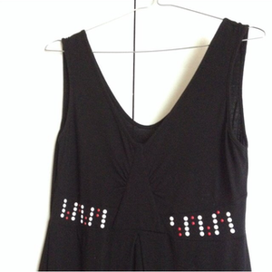 Sleeveless black dress with white/red studs M is being swapped online for free