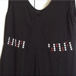 Sleeveless black dress with white/red studs M is being swapped online for free
