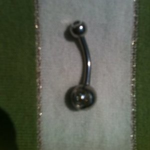 Belly piercing with small rhinestone nickel-free stainless steel is being swapped online for free