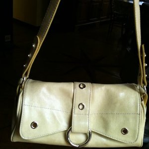 Made In Italy faux-leather cream-yellow handbag is being swapped online for free