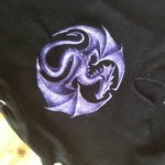 V-neck black and purple dragon top, ties on sides with strings, size xs is being swapped online for free