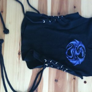 V-neck black and purple dragon top, ties on sides with strings, size xs is being swapped online for free