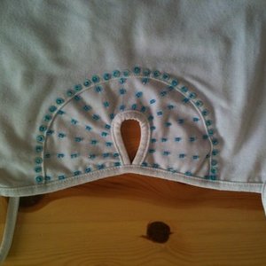 White spaghetti top with peep-hole and blue sequins is being swapped online for free