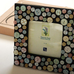 Dennis East Button Photo frame  is being swapped online for free