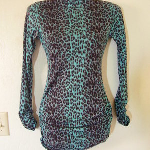 teal leopard turtleneck is being swapped online for free