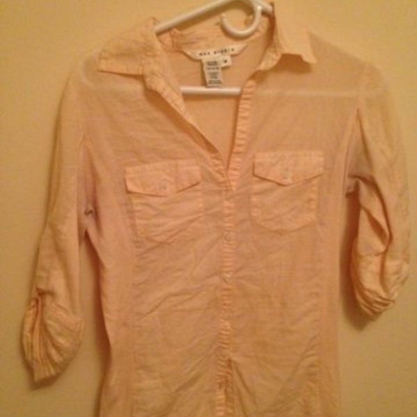 Peach button down top is being swapped online for free