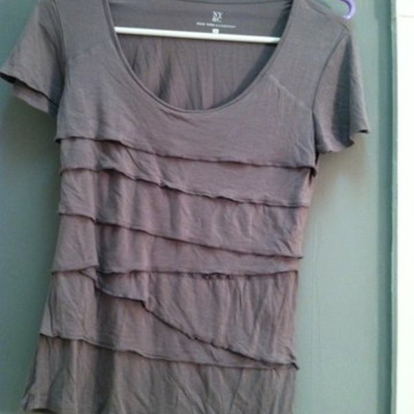 Express Ruffle Grey Shirt is being swapped online for free