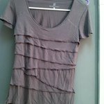 Express Ruffle Grey Shirt is being swapped online for free